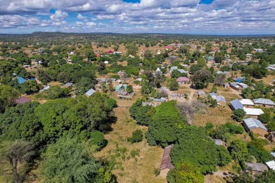 Community members gathered outdoors in Mapogoro village, Ruaha Landscape