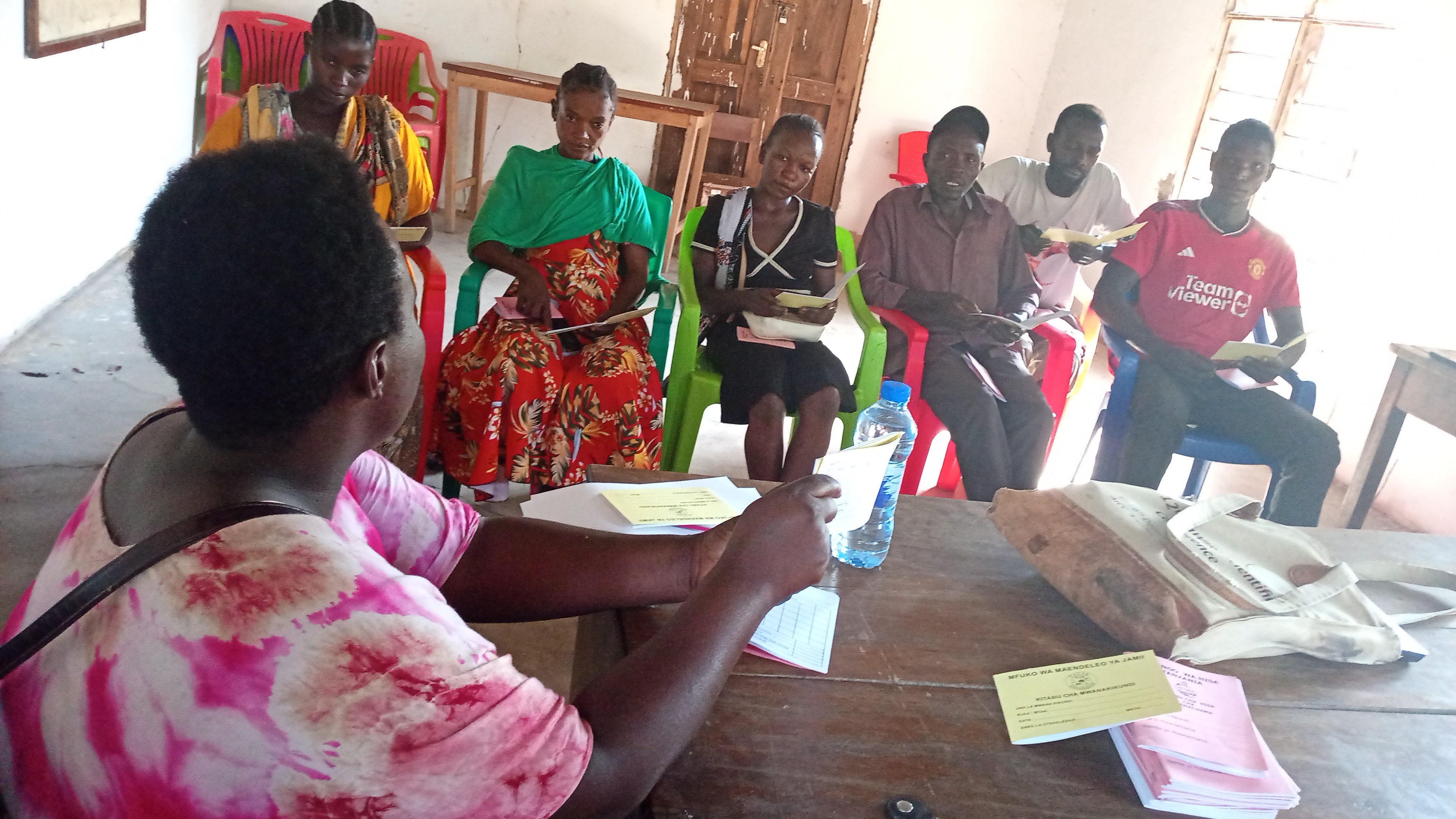 Members of a village savings and loan group meeting in Mapogoro